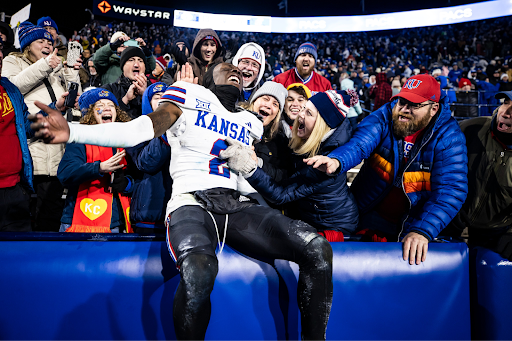Kansas Cornerback Cobee Bryant celebrates with fans after upsetting No. 6 BYU 17-13