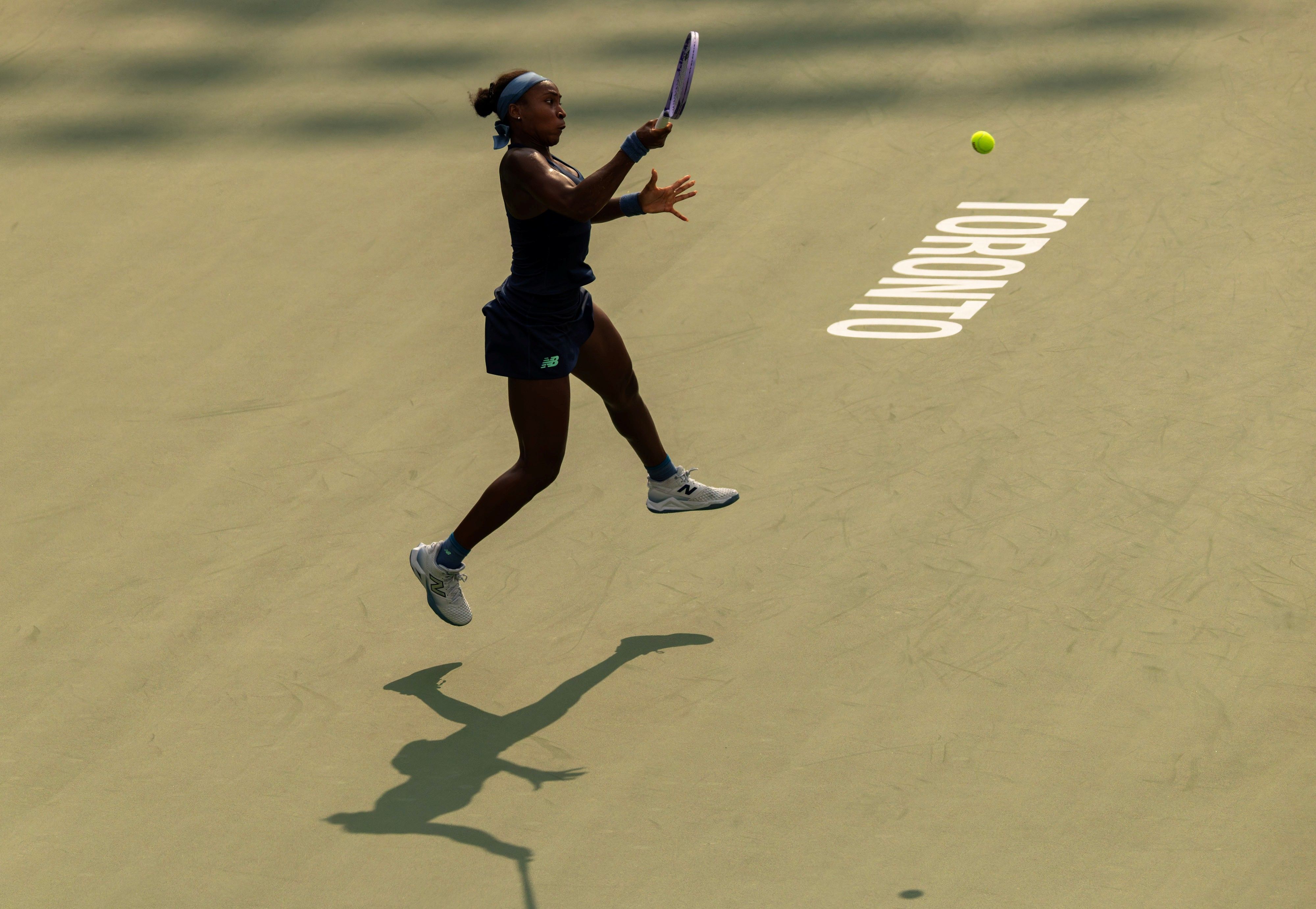 Coco Gauff of the United States returns the ball during the women's singles round of 16 match. 