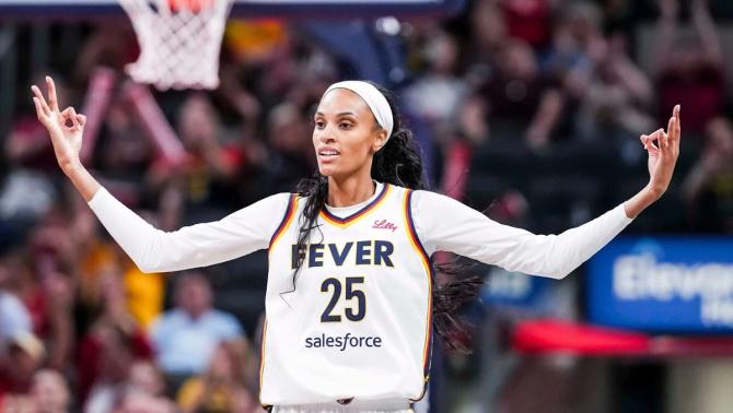 The Indiana Fever’s DeWanna Bonner celebrates after knocking down a three-pointer.