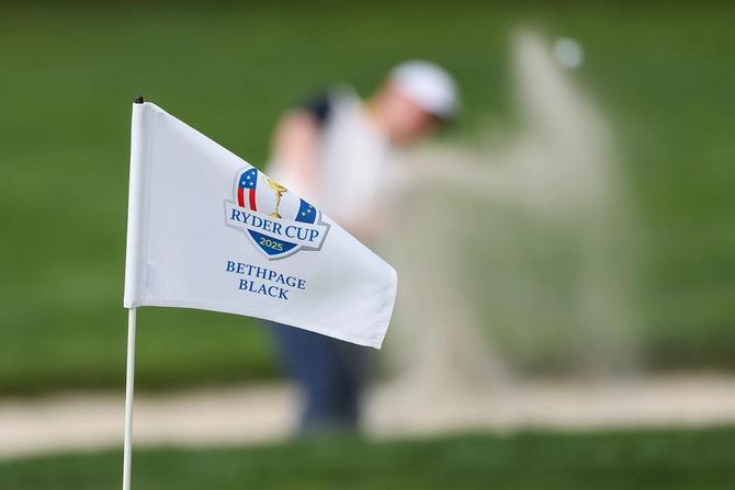 The Ryder Cup 2025 flag blows in the wind.