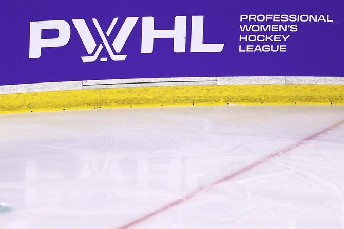 PWHL logo on a rink board