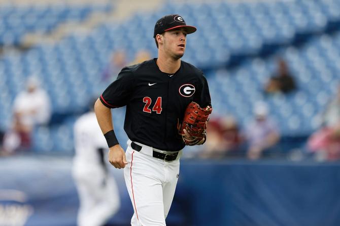 Georgia third baseman and 2024 Golden Spikes Award winner (college baseball’s MVP honor) Charlie Condon jogs off the field.