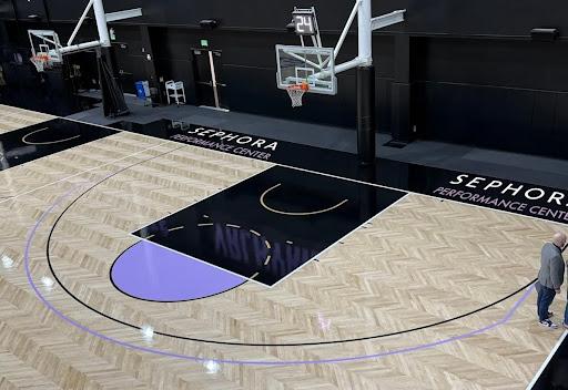 An overhead view of a basketball court with a Sephora logo on it.
