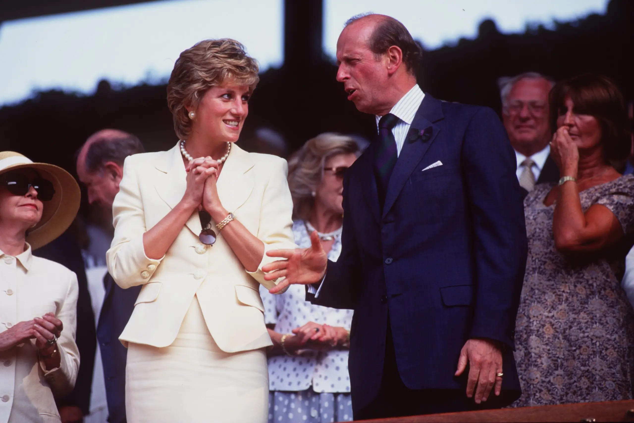 Princess Diana talking to the Prince of Kent watching Wimbledon