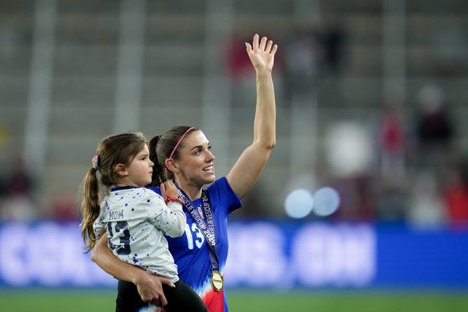 Alex Morgan of the United States celebrates with her daughter, Charlie, during the SheBelieves Cup Final.