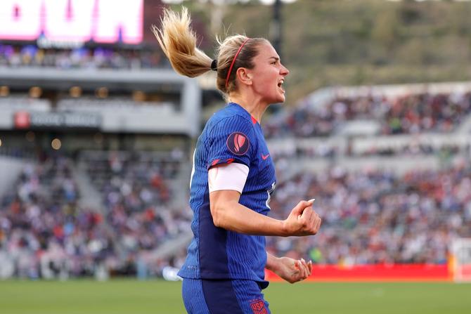 Midfielder Lindsey Horan celebrates after scoring the winning goal in the Concacaf W Gold Cup final.