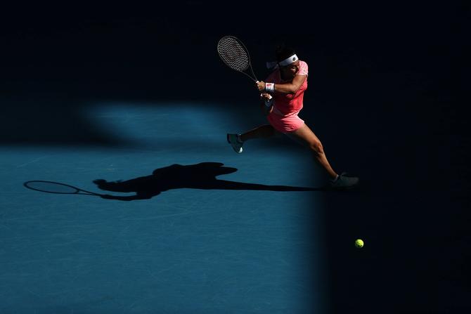 Ons Jabeur of Tunisia plays a backhand in her Women's Singles third round match against Naomi Osaka of Japan during day five of the 2021 Australian Open at Melbourne Park on February 12, 2021 in Melbourne, Australia.