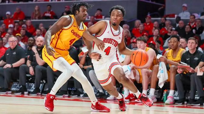 Houston men’s basketball guard L.J. Cryer dribbles around an opponent.