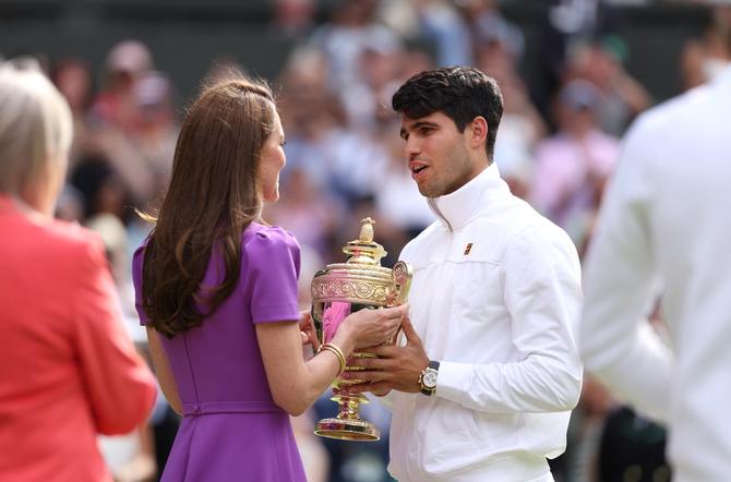 Catherine, Princess of Wales, Patron of The AELTC, presents the Gentlemen's Singles Trophy to Carlos Alcaraz of Spain