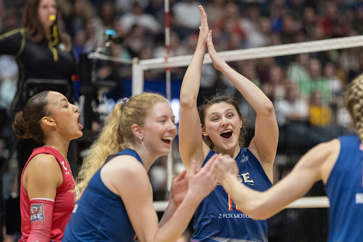 Grand Rapids Rise outside hitter Paige Briggs-Romine (13) celebrates with her team during a match on Friday, March 28, 2025 at Van Andel Arena in downtown Grand Rapids, Mich. Grand Rapids Rise beat the Columbus Fury 3-2 going 15-13 in the final set.
