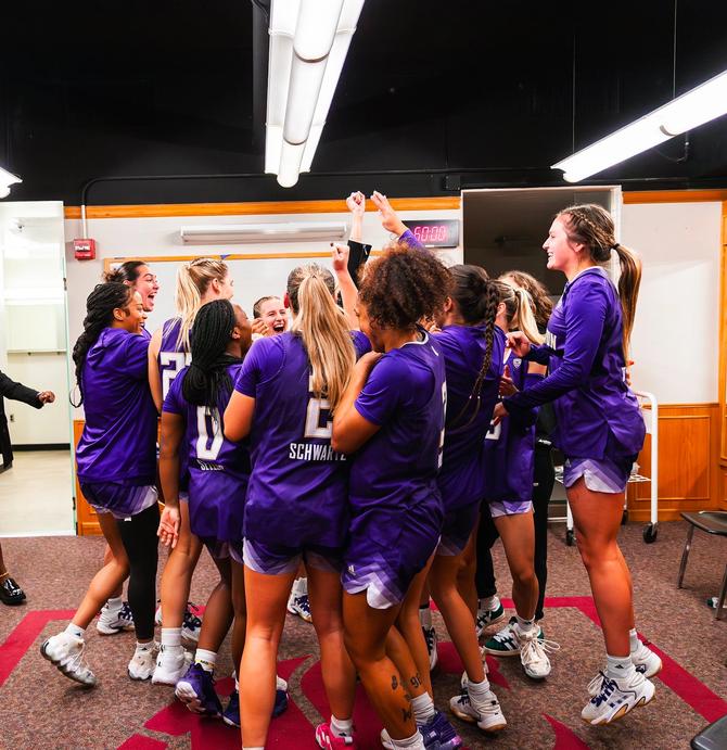 Washington women’s basketball team cheering in the locker room