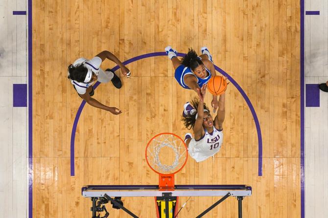 LSU junior Angel Reese jumps for a rebound.