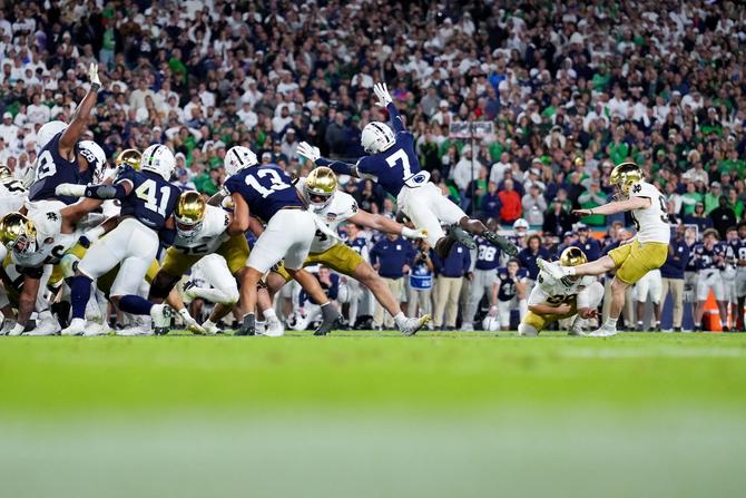 Mitch Jeter #98 of the Notre Dame Fighting Irish kicks the game-winning field goal