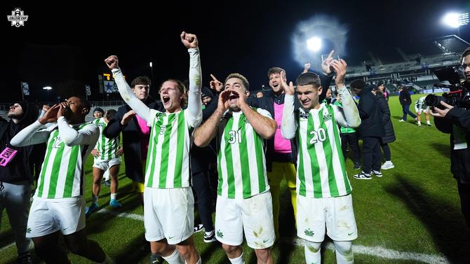 Marshall men’s soccer celebrates with fans after advancing to the College Cup final.