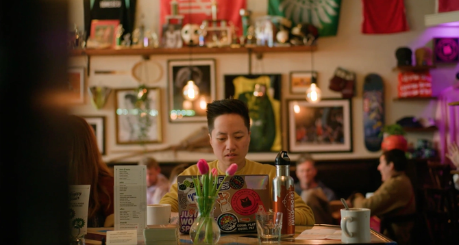 The Sports Bra owner Jenny Nguyen typing on her laptop