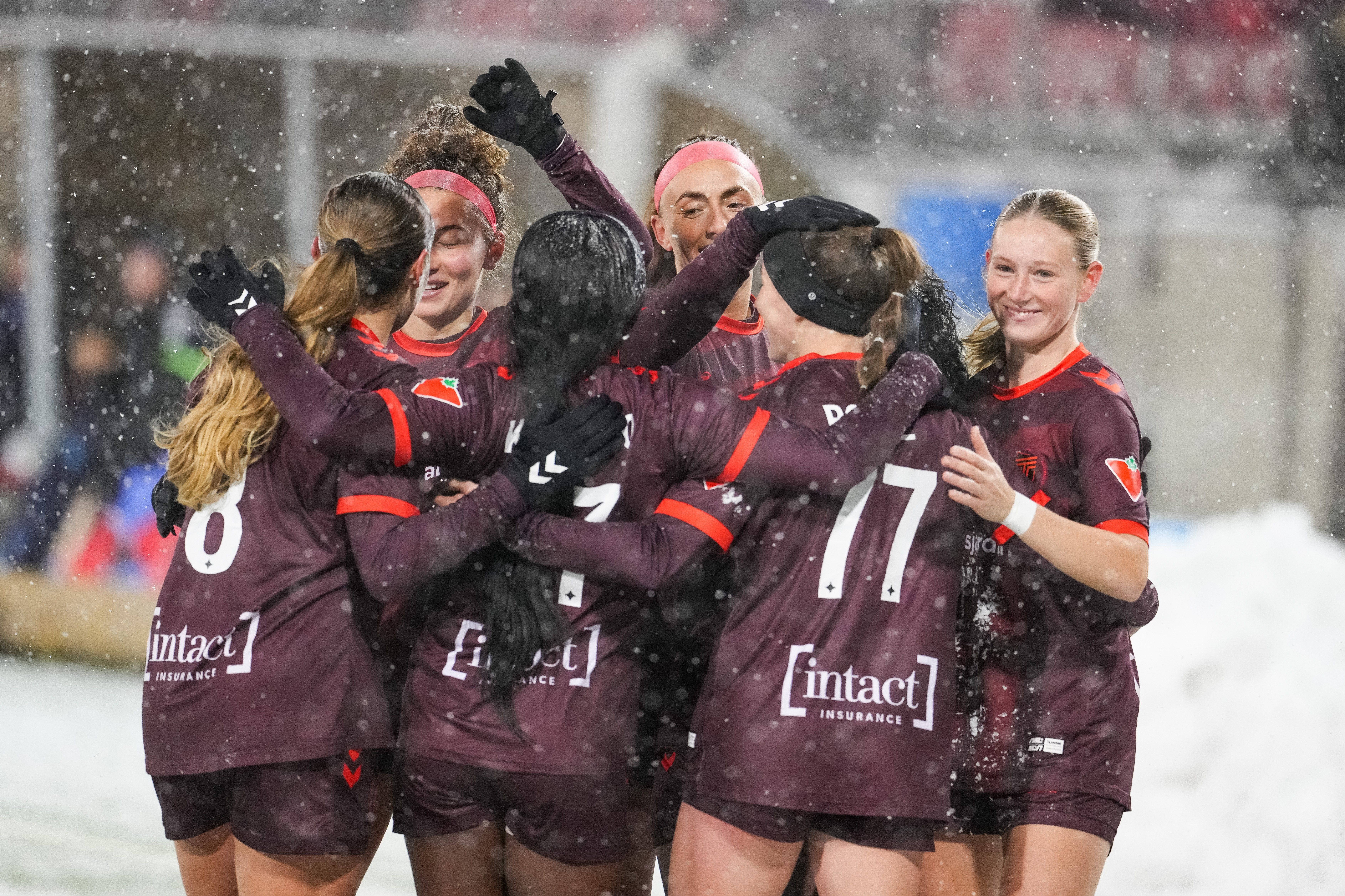 AFC Toronto teammates celebrate a goal by Lauren Rowe (77) of AFC Toronto in Northern Super League semi-final action between AFC Toronto and the Montreal Roses FC at the York Lions stadium