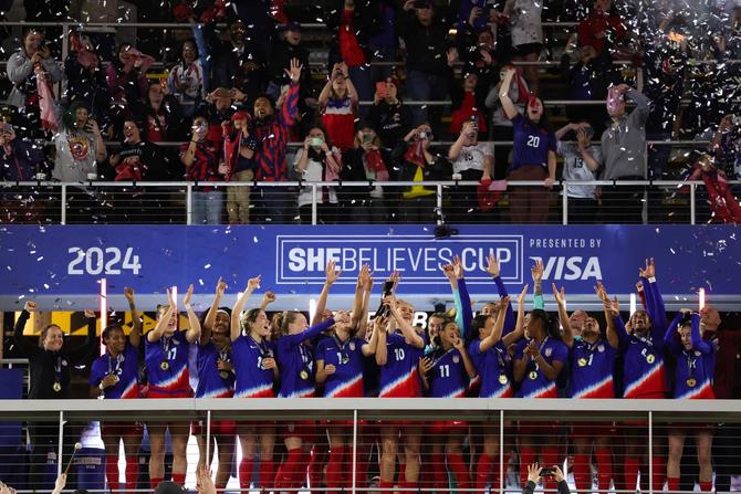 United States players celebrate winning the SheBelieves Cup against Canada in the 2024 SheBelieves Cup.