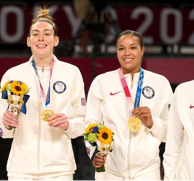 Breanna Stewart and Napheesa Collier wearing gold medals on stand after game vs Japan after Women's Gold Medal Game at Saitama Super Arena.