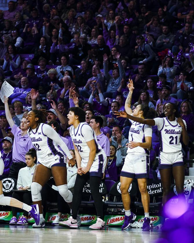 The Kansas State women’s basketball team celebrates a made 3-pointer.
