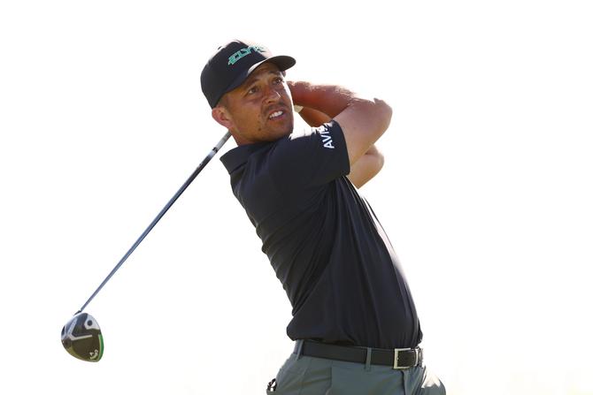 Xander Schauffele of the United States plays his shot from the seventh tee during the first round of The Sentry 2025.