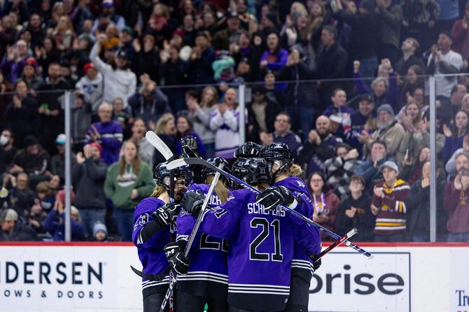 PWHL Minnesota celebrates on the ice as fans cheer