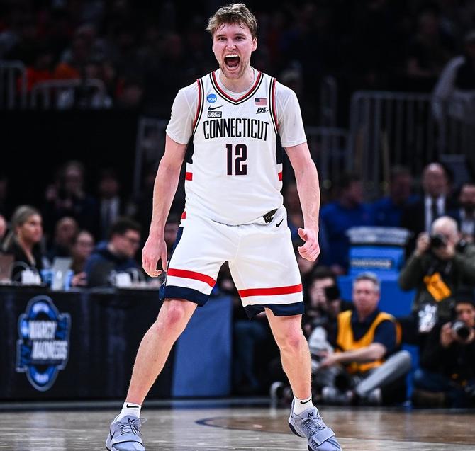 No. 1–seed UConn men’s basketball guard Cam Spencer strikes a celebratory power pose during last night’s Sweet 16 win over No. 5 San Diego State.