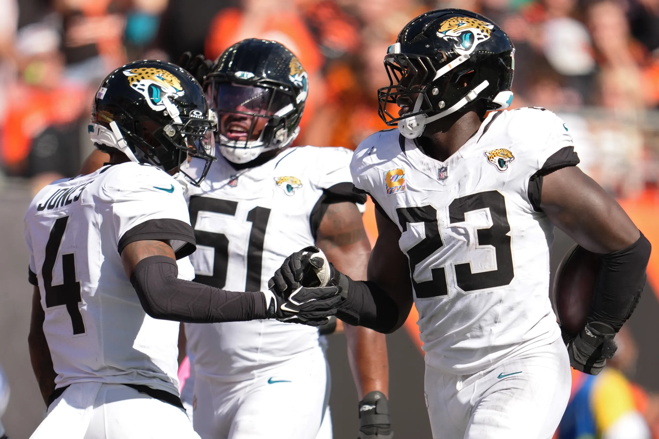 Jacksonville Jaguars linebacker Foyesade Oluokun celebrates with teammate Jarrian Jones after making an interception.
