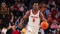 Bronny James Jr. dribbles in his college basketball debut for USC.