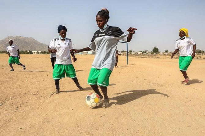 Nigerian refugee girls train during a session at the football pitch in the Minawao Refugee camp.