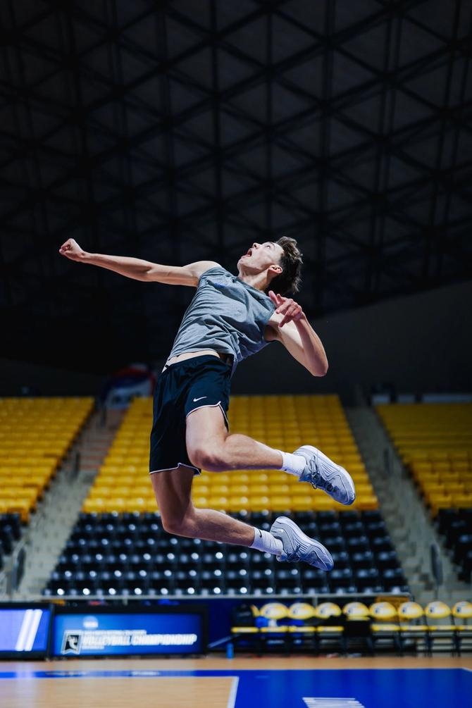 UCLA men’s volleyball opposite David Decker takes a swing during practice.