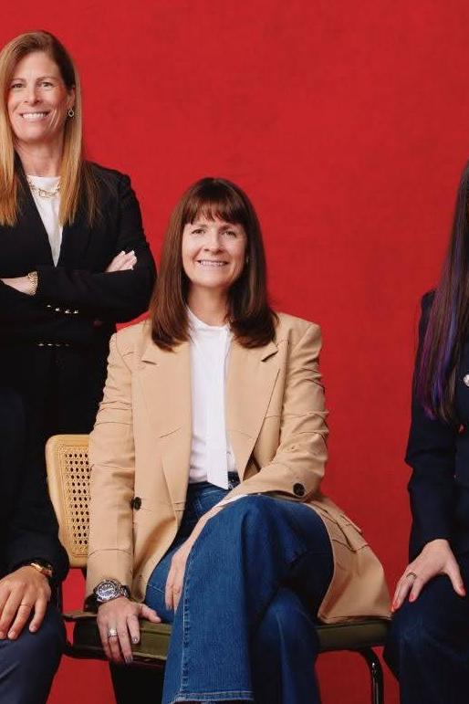 Several members of the LOVB SF ownership pose for a photo.