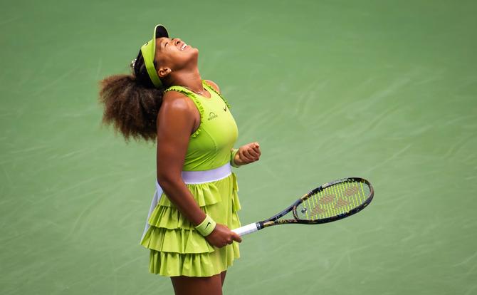 Naomi Osaka of Japan reacts to defeating Jelena Ostapenko of Latvia in the first round on Day 2 of the US Open.