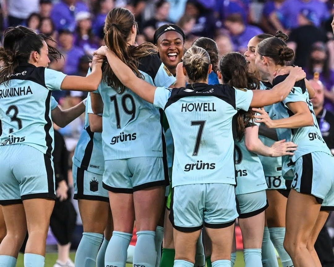 Jaedyn Shaw is surrounded by her teammates after advancing to the NWSL Championship.