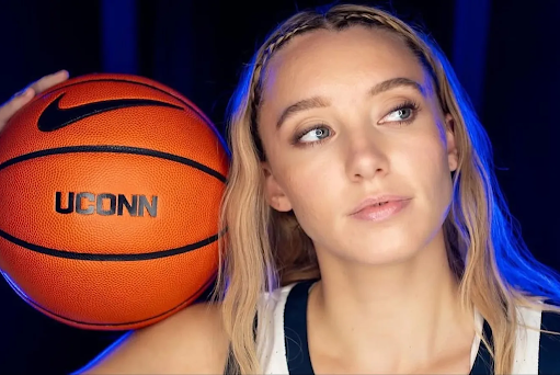 UConn star Paige Bueckers poses with a basketball.