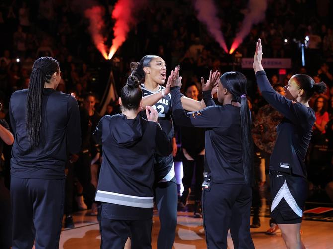 A'ja Wilson #22 of the Las Vegas Aces is greeted on the court by teammates (L-R) Kiah Stokes #41, Kelsey Plum #10, Jackie Young #0, and Alysha Clark #7 during player introductions before a game against the New York Liberty at Michelob ULTRA Arena on June 15, 2024 in Las Vegas, Nevada.
