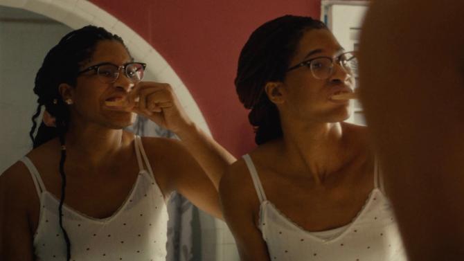 Individuals are pictured brushing their teeth 