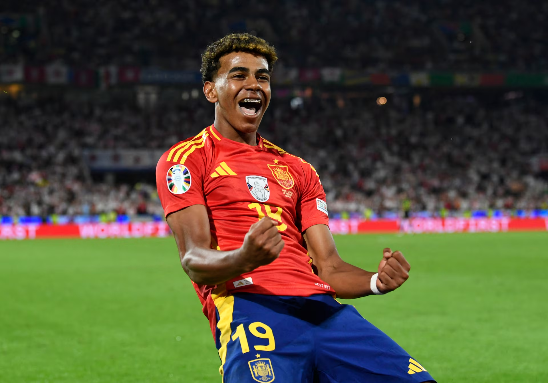 Lamine Yamal celebrates scoring a goal. 