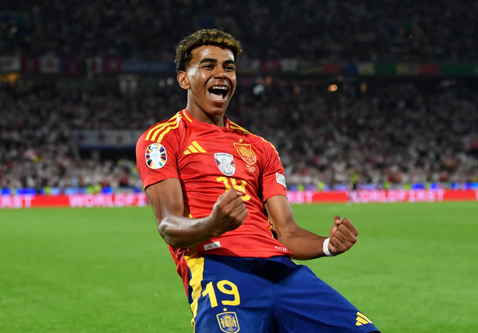 Lamine Yamal celebrates scoring a goal.