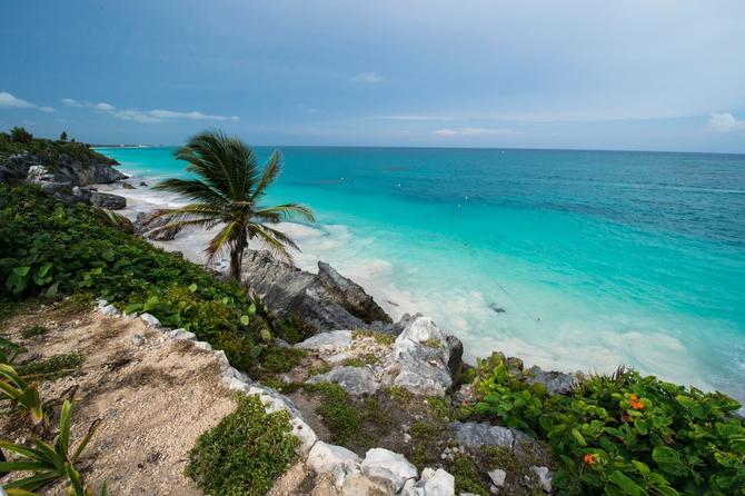 A view of the cliffs and crystal clear waters in Tulum.