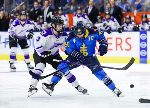 The Minnesota Frost’s Brooke McQuigge and the Toronto Sceptres’ Blayre Turnbull battle for the puck in the opening round of the 2025 PWHL playoffs
