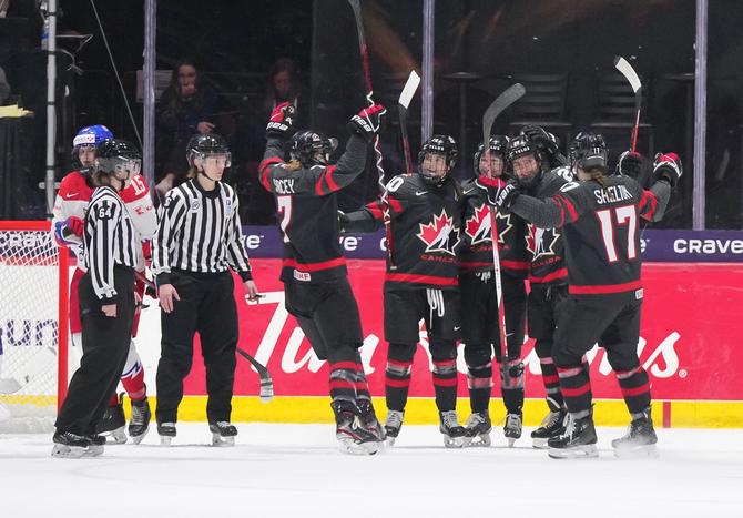 Team Canada celebrating on the ice