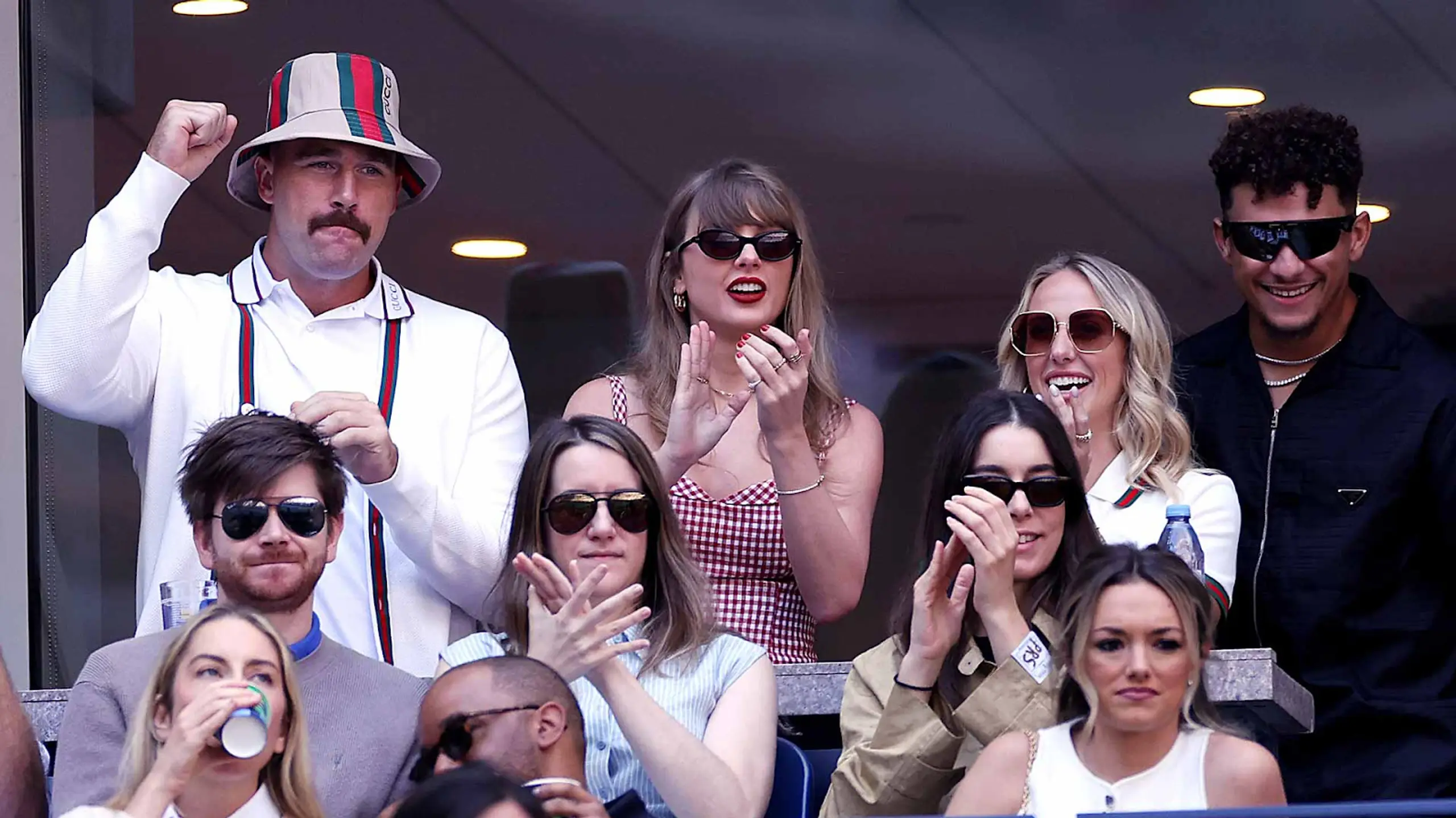 Travis Kelce, Taylor Swift, Brittany Mahomes, and Patrick Mahomes cheer at the 2024 US Open.