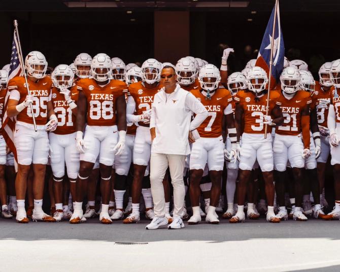 The Texas football team waits to run out of the tunnel before a game.
