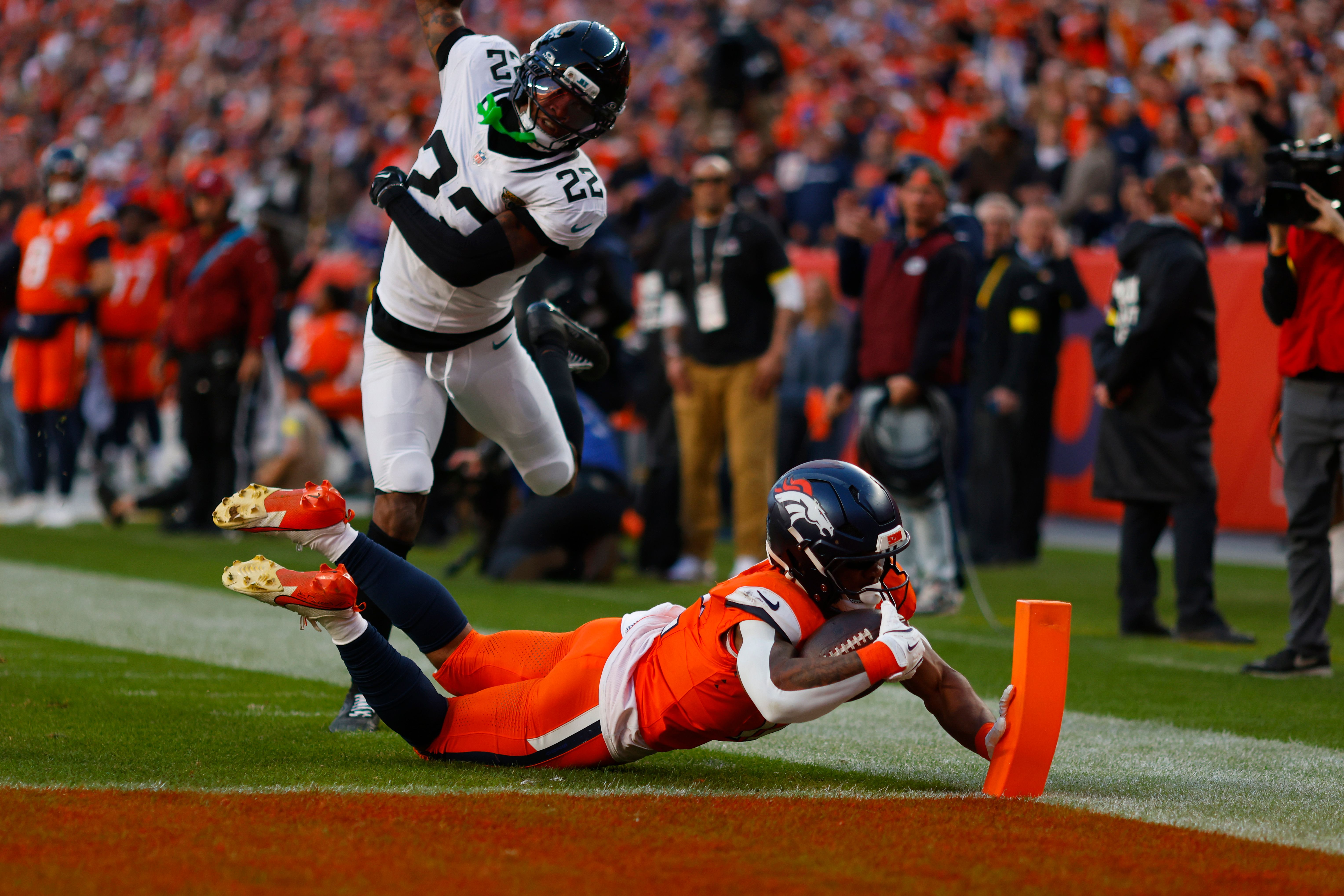 Denver Broncos running back R.J. Harvey dives into the end zone for a touchdown.
