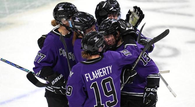 PHWL Minnesota huddles up after a goal.
