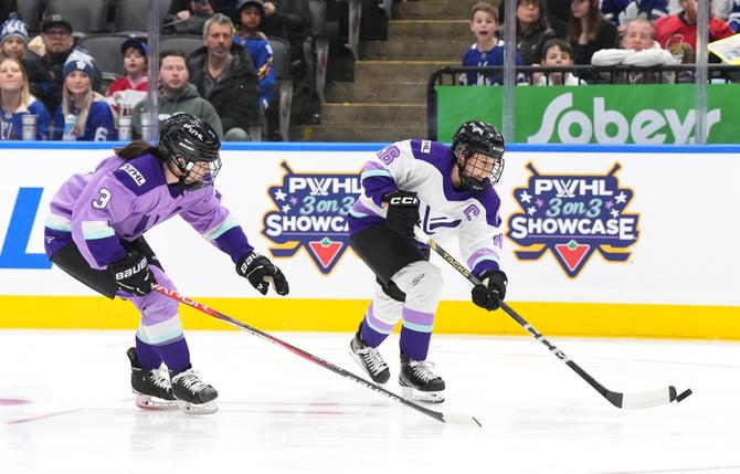 Kendall Coyne Schofield #26 of Team King plays the puck as Jocelyne Larocque #3 of Team Kloss pursues the play during the Canadian Tire PWHL 3-on-3 Showcase between Team King and Team Kloss at Scotiabank Arena on February 01, 2024 in Toronto, Ontario.