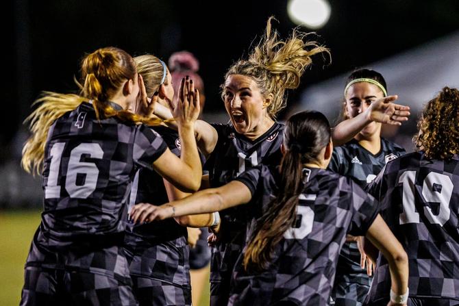 The Mississippi State women’s soccer team celebrates a goal.
