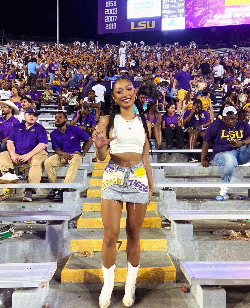 An LSU fan poses at a game. 
