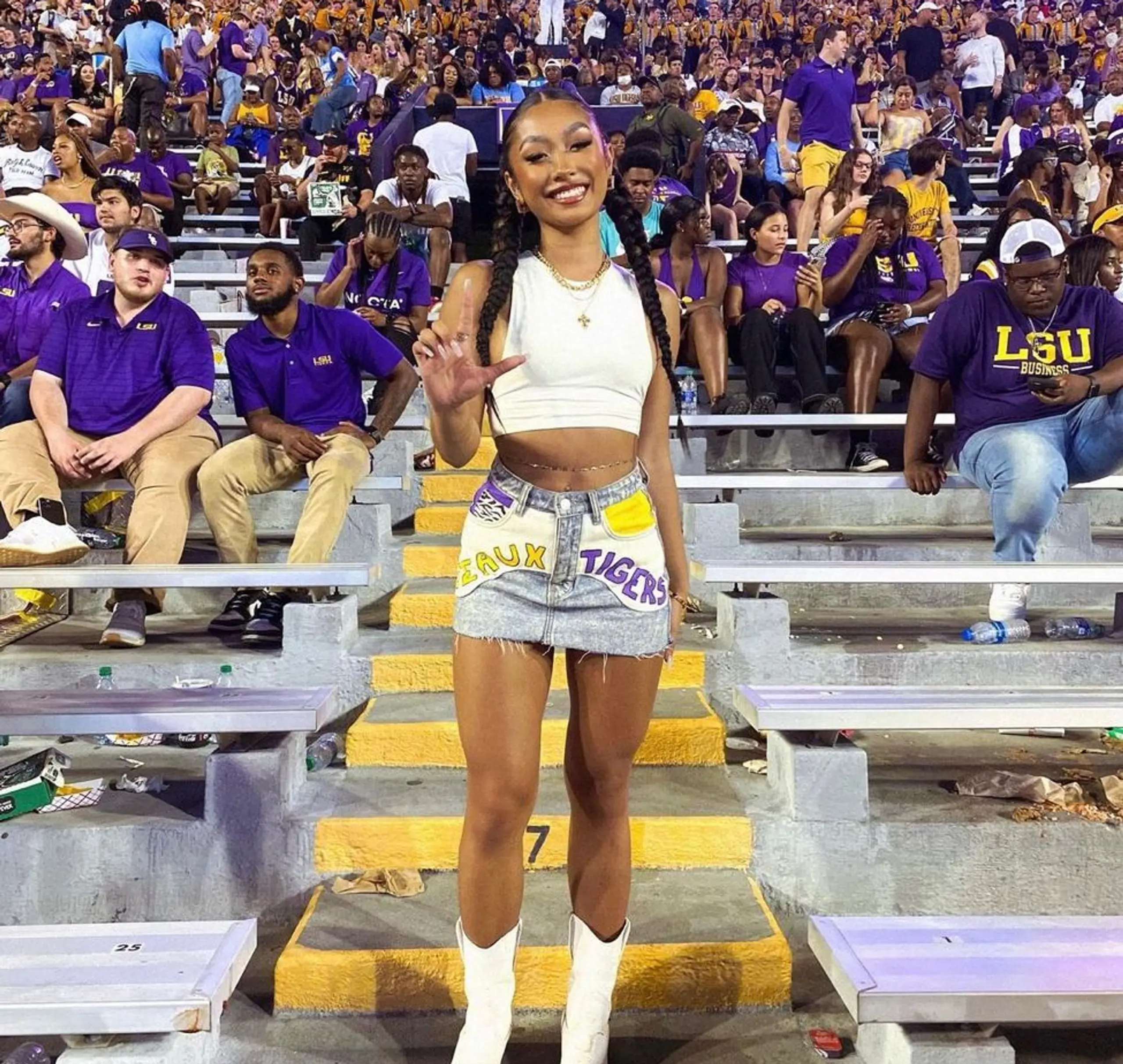 An LSU fan poses at a game.