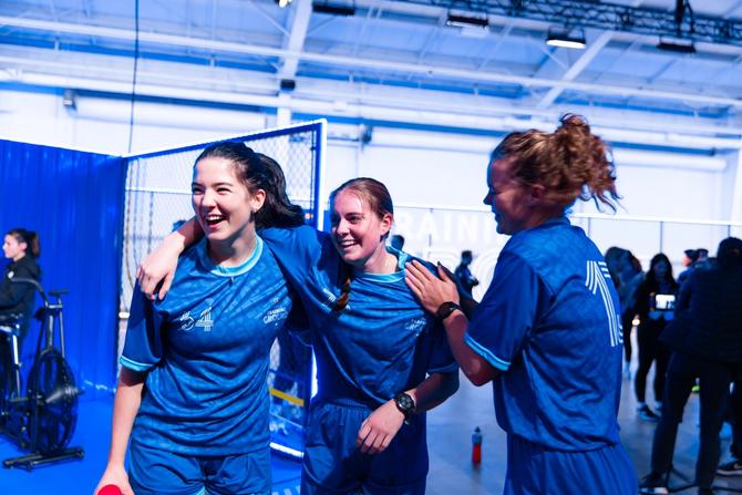 Three athletes celebrating at RBC Training Ground
